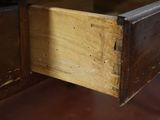 a wooden drawer with a wooden handle on it