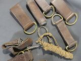 five pieces of leather and a rope on a gray surface