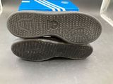 a pair of shoes that are on top of a box