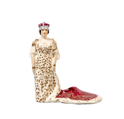 a figurine of a woman in a leopard print dress