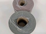 two rolls of toilet paper sitting next to each other on a table