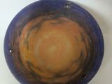 a bowl that is sitting on a white table