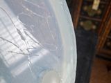 a plastic container with a hole in it sitting on a table