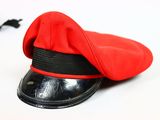 a red hat with a black band on top of it