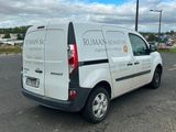 a white van that is parked on the side of the road