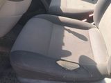 an image of a dirty car with the front seats down