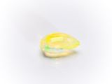 yellow oplite gems on a white background