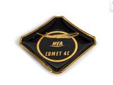 a black and gold plate with a logo on it