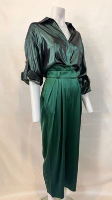 green satin dress with black satin jacket and matching skirt