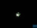 an image of a green light shines in the dark