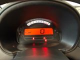 a car dashboard with a speedometer and a clock on it