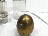 two salt and pepper shakers sitting on a table
