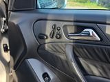 a car door with the door handle open on the side of the road