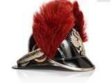 a black helmet with a red feather on it