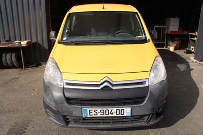 a yellow van that is parked in front of a building
