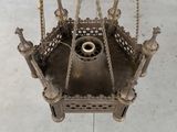 a metal object hanging from the ceiling of a building