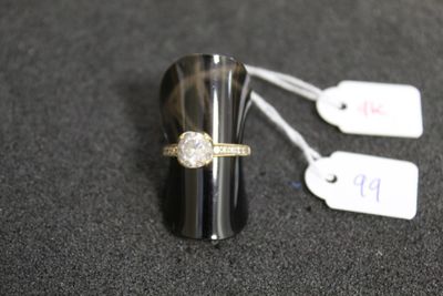 a ring that is sitting on top of a black object