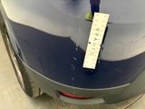 a sticker on the hood of a car that has a ruler attached to it