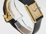 a close up of a wrist watch with a black leather band