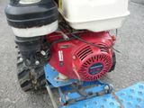 a close up of a small engine on the ground
