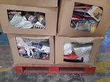 two boxes with items in them sitting on a pallet