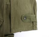 an image of a close up of a shirt with a button on it