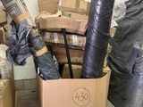 a pile of boxes and other items in a room