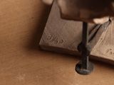 a drill that is sitting on top of a piece of wood