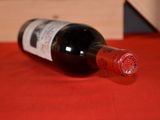 a bottle of wine that is sitting on a table
