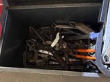 a metal box with tools inside of it on the floor