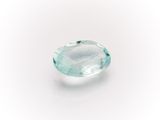 an oval aquamarinee gemstone on a white background