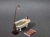 a bathtub with a man in it and a rug on the floor