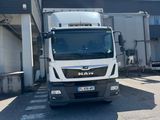a truck that is parked in front of a building