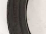 a close up of a tire tire on a white surface