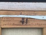 a picture of a wooden frame with writing on it
