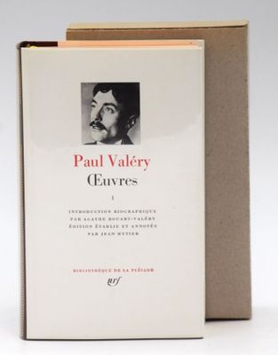 the book is opened to reveal a picture of a man with a mustache
