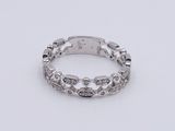 a close up of a silver ring on a white surface