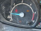 a close up of a car dashboard with a speedometer
