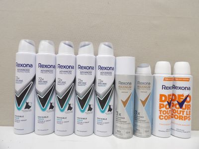several different types of deodorante sprays are lined up on a counter