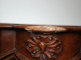 a close up of a wooden table with a mirror on it