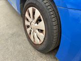 a close up of a car ' s tire on the road