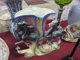 a table with vases, plates, and vases on it