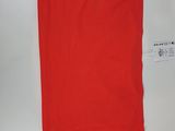 a red polo shirt on a white background with a tag