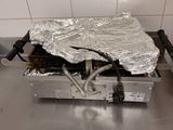 a metal table with a piece of tin foil on top of it