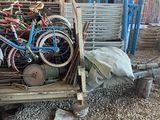many bicycles in the back of a truck in a yard
