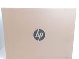 a laptop that is open on a white surface