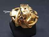 an image of a gold ring with a brown stone in the center