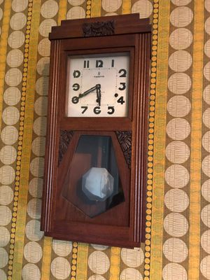 a clock hanging on the wall of a room