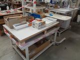 a table with a lot of boxes on it in a room