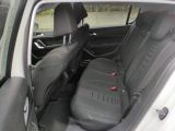 the back seats of a small car are black and grey
